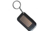 A mini lanterna elétrica vermelha, cor preta, azul da tocha da porta-chaves das energias solares do diodo emissor de luz escolhe